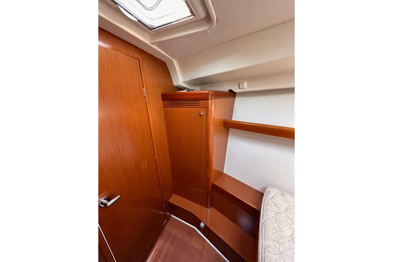 Shamrock Yacht Photos Pics Interior cabin of 2011 Beneteau Oceanis 40 yacht with wooden finish.