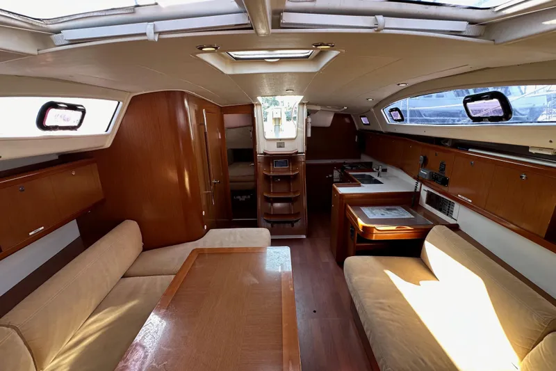 Shamrock Yacht Photos Pics Interior of 2011 Beneteau Oceanis 40 sailboat with wood finish and seating area.