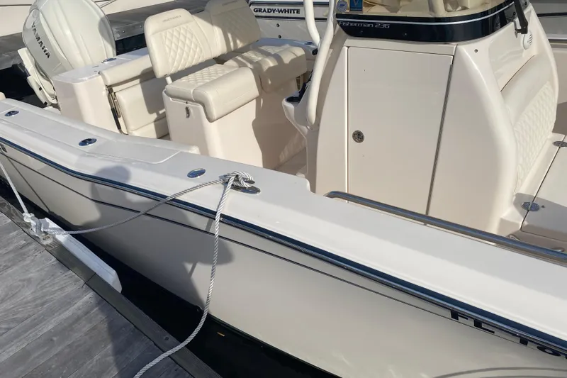  Yacht Photos Pics 2025 Grady-White Fisherman 236 boat docked, featuring comfortable seating and Yamaha engine.
