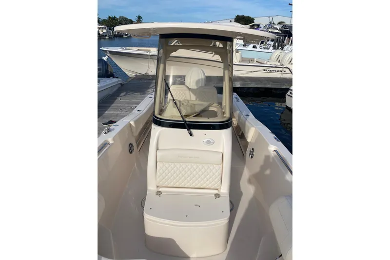  Yacht Photos Pics 2025 Grady-White Fisherman 236 boat docked, showcasing sleek design and comfortable seating.