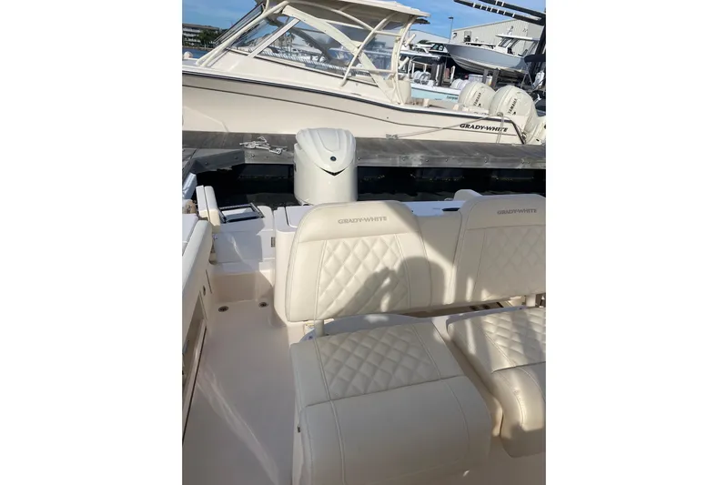  Yacht Photos Pics 2025 Grady-White Fisherman 236 boat interior with cushioned seating and sleek design.