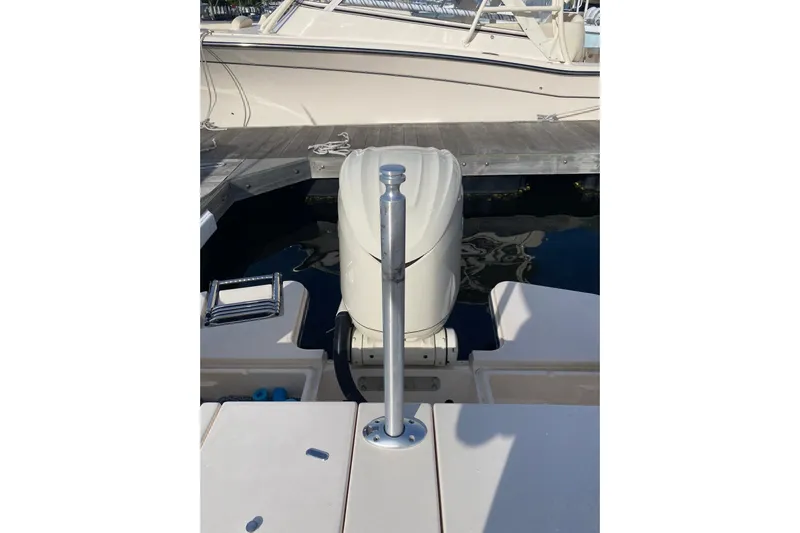  Yacht Photos Pics 2025 Grady-White Fisherman 236 boat stern view with outboard motor at dock.