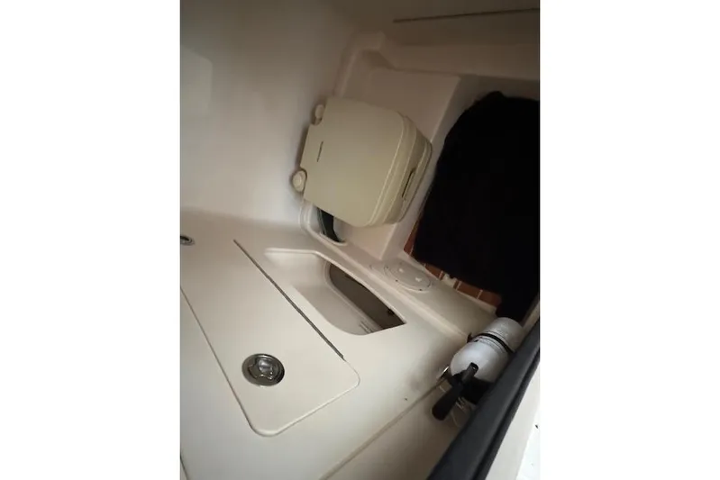  Yacht Photos Pics 2025 Grady-White Fisherman 236 interior cabin with storage compartments.