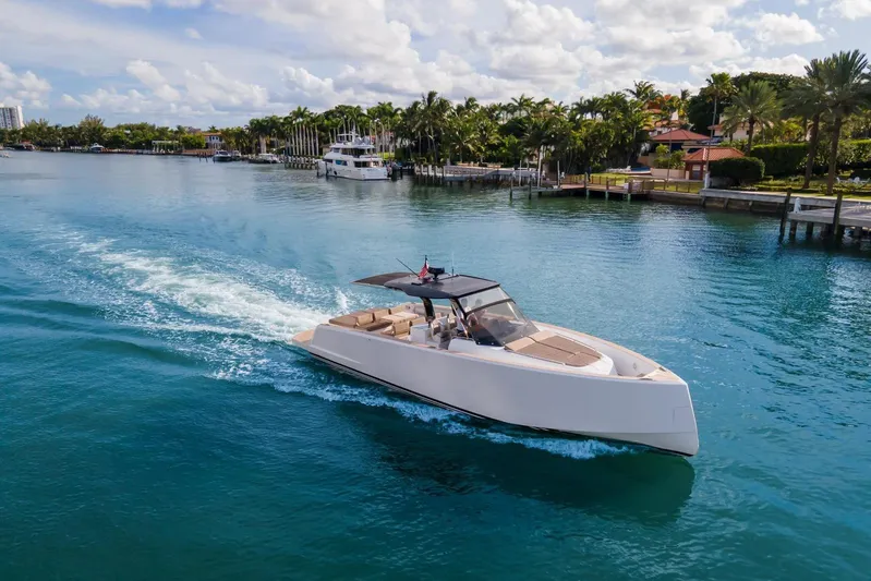 Darya One Yacht Photos Pics 2019 Pardo Yachts P43 cruising on a scenic waterway with palm trees.