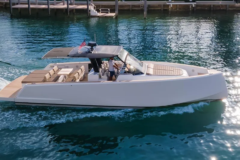 Darya One Yacht Photos Pics 2019 Pardo Yachts P43 cruising on clear blue water near a dock.