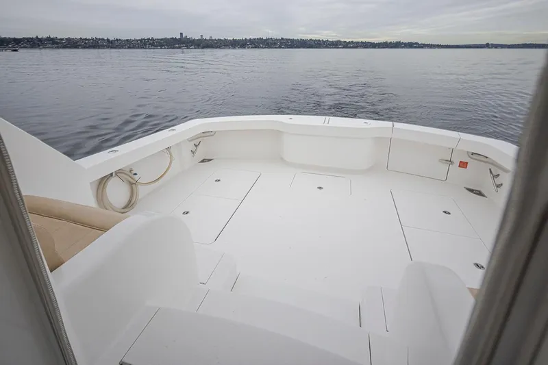 Mixer Yacht Photos Pics Spacious deck of a 2015 Viking 52 yacht on calm waters.