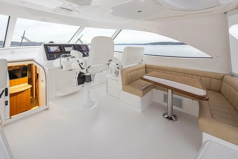 Mixer Yacht Photos Pics Luxurious interior of 2015 Viking 52 yacht with helm station and seating area.