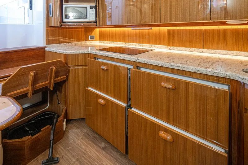 Mixer Yacht Photos Pics Modern kitchen in 2015 Viking 52 yacht with wooden cabinets and granite countertops.