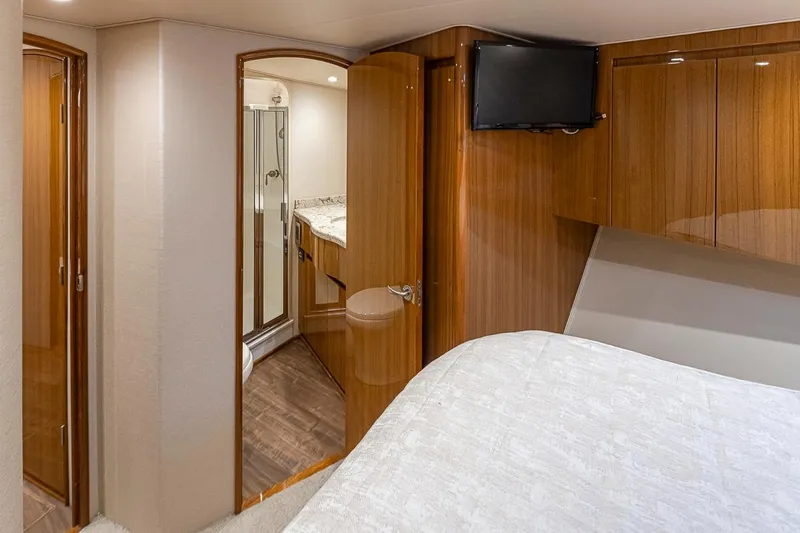 Mixer Yacht Photos Pics Luxurious interior of 2015 Viking 52 yacht with bedroom and en-suite bathroom.