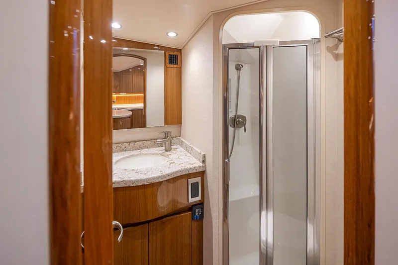 Mixer Yacht Photos Pics Luxurious bathroom in a 2015 Viking 52 yacht with shower and vanity.