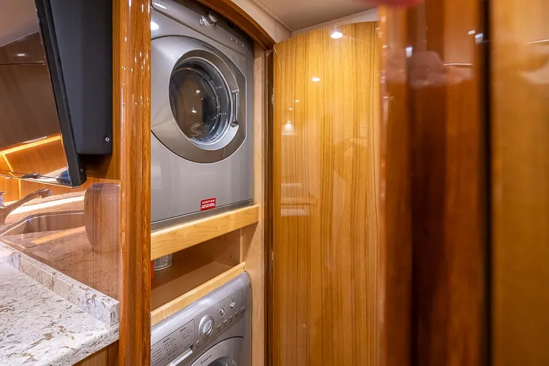 Mixer Yacht Photos Pics Laundry area with washer and dryer in 2015 Viking 52 yacht.