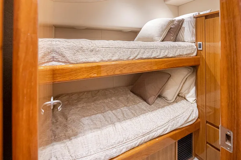 Mixer Yacht Photos Pics Bunk beds in the cozy cabin of a 2015 Viking 52 yacht.
