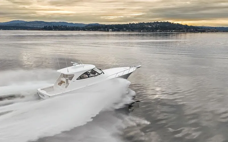 Mixer Yacht Photos Pics 2015 Viking 52 yacht cruising on calm waters at sunset.