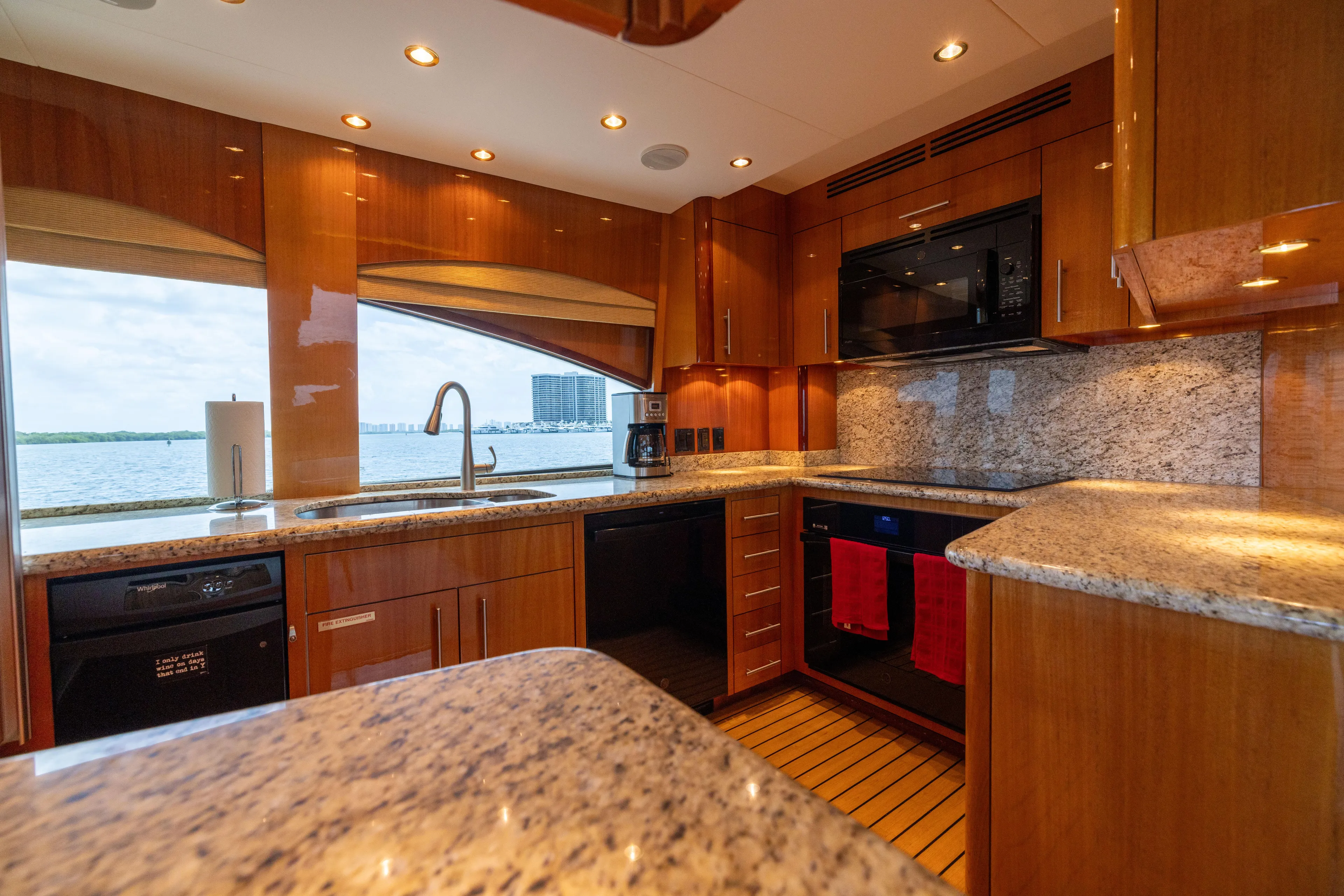 Outrageous Yacht Photos Pics Luxurious kitchen interior of 2005 Hatteras 80 Motor Yacht with granite countertops.