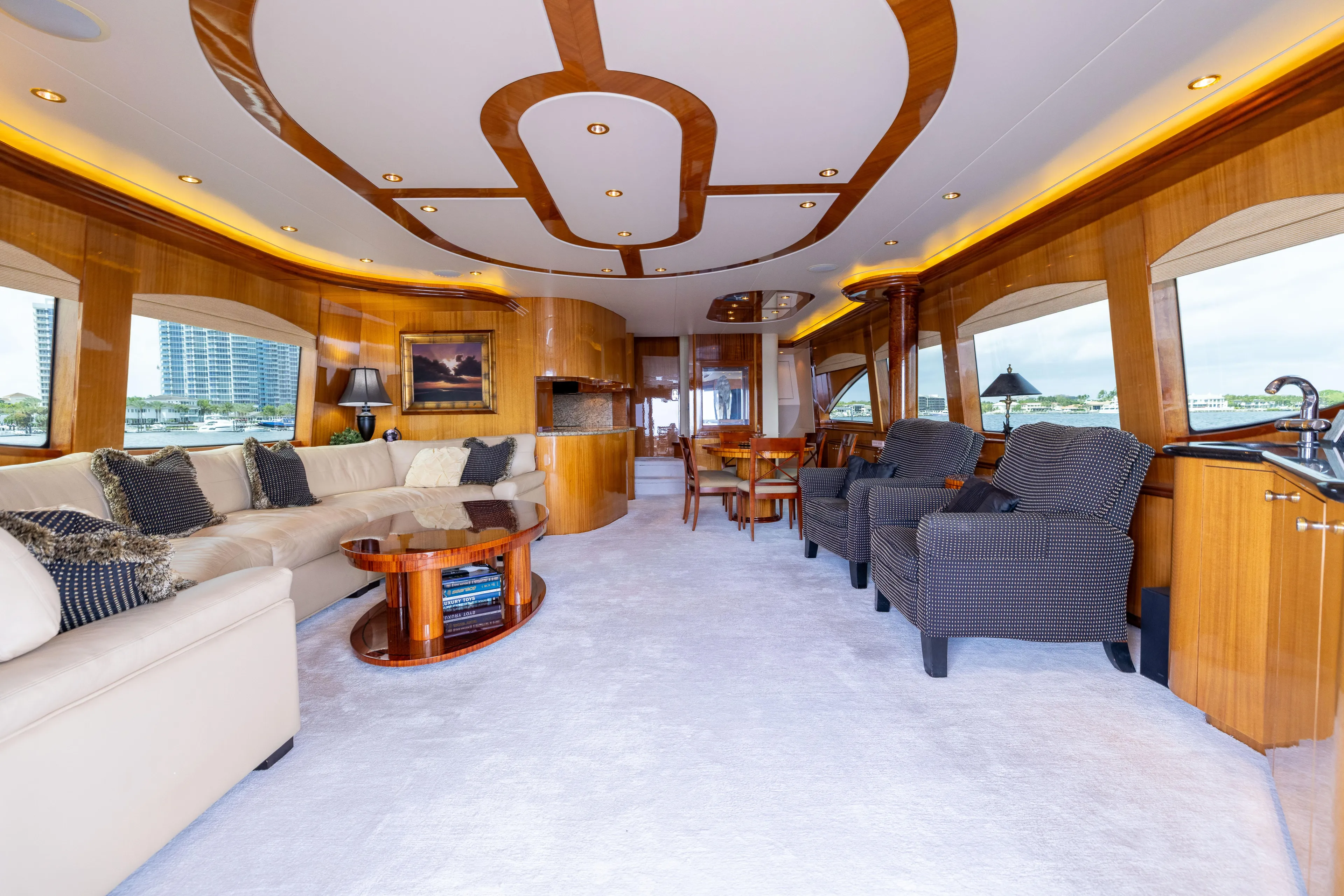 Outrageous Yacht Photos Pics Luxurious interior of 2005 Hatteras 80 Motor Yacht with elegant seating and wood accents.