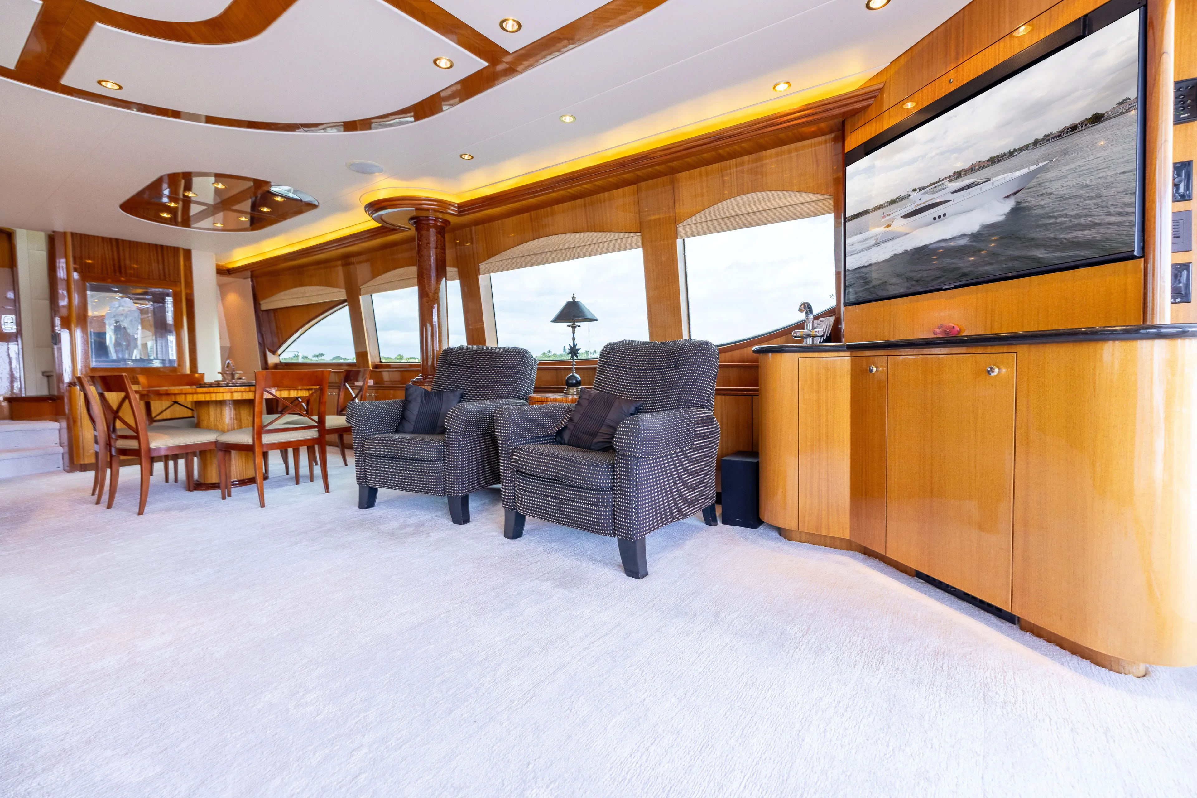 Outrageous Yacht Photos Pics Luxurious interior of 2005 Hatteras 80 Motor Yacht with elegant seating and wood finishes.