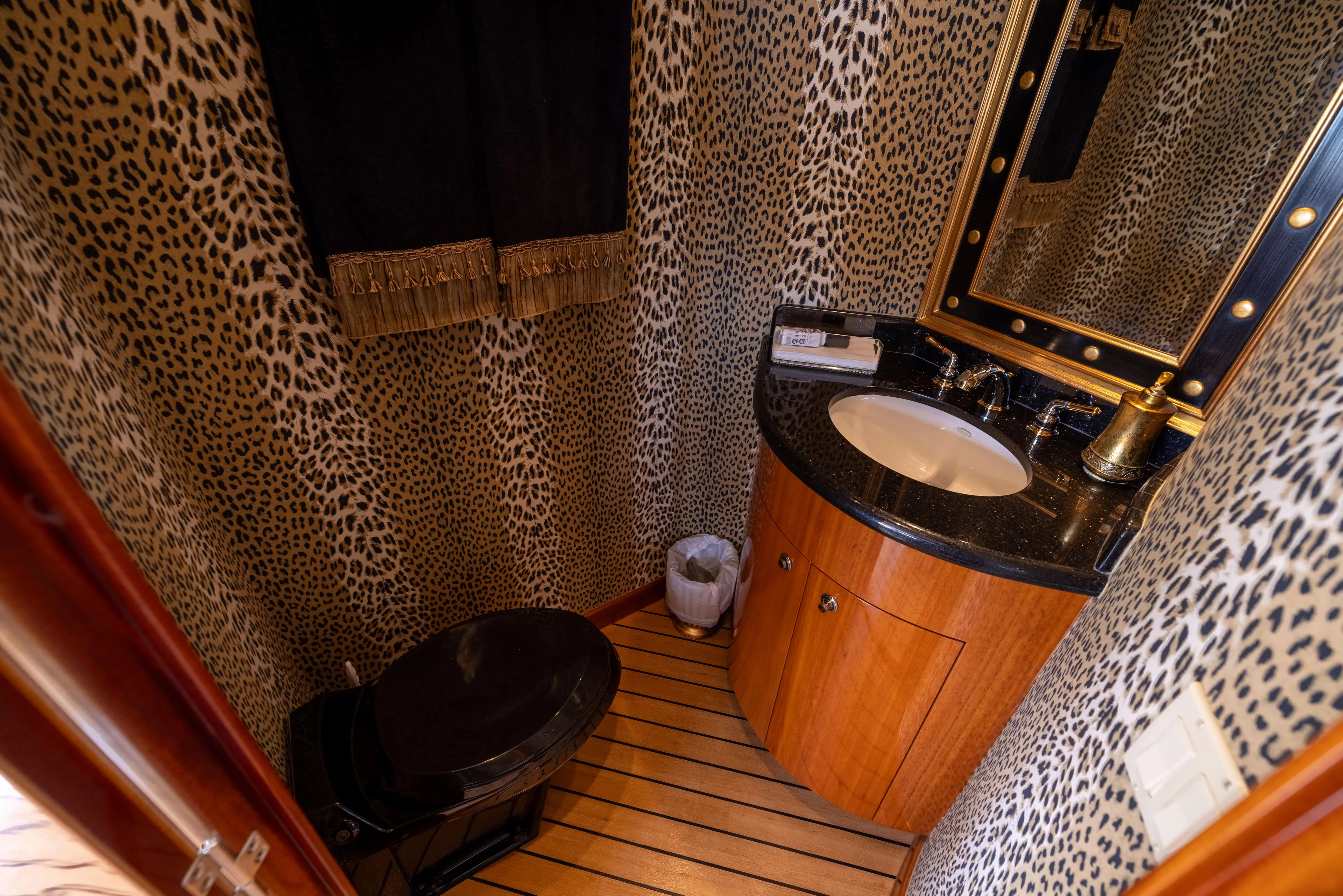 Outrageous Yacht Photos Pics Luxurious bathroom with leopard print walls in 2005 Hatteras 80 Motor Yacht.