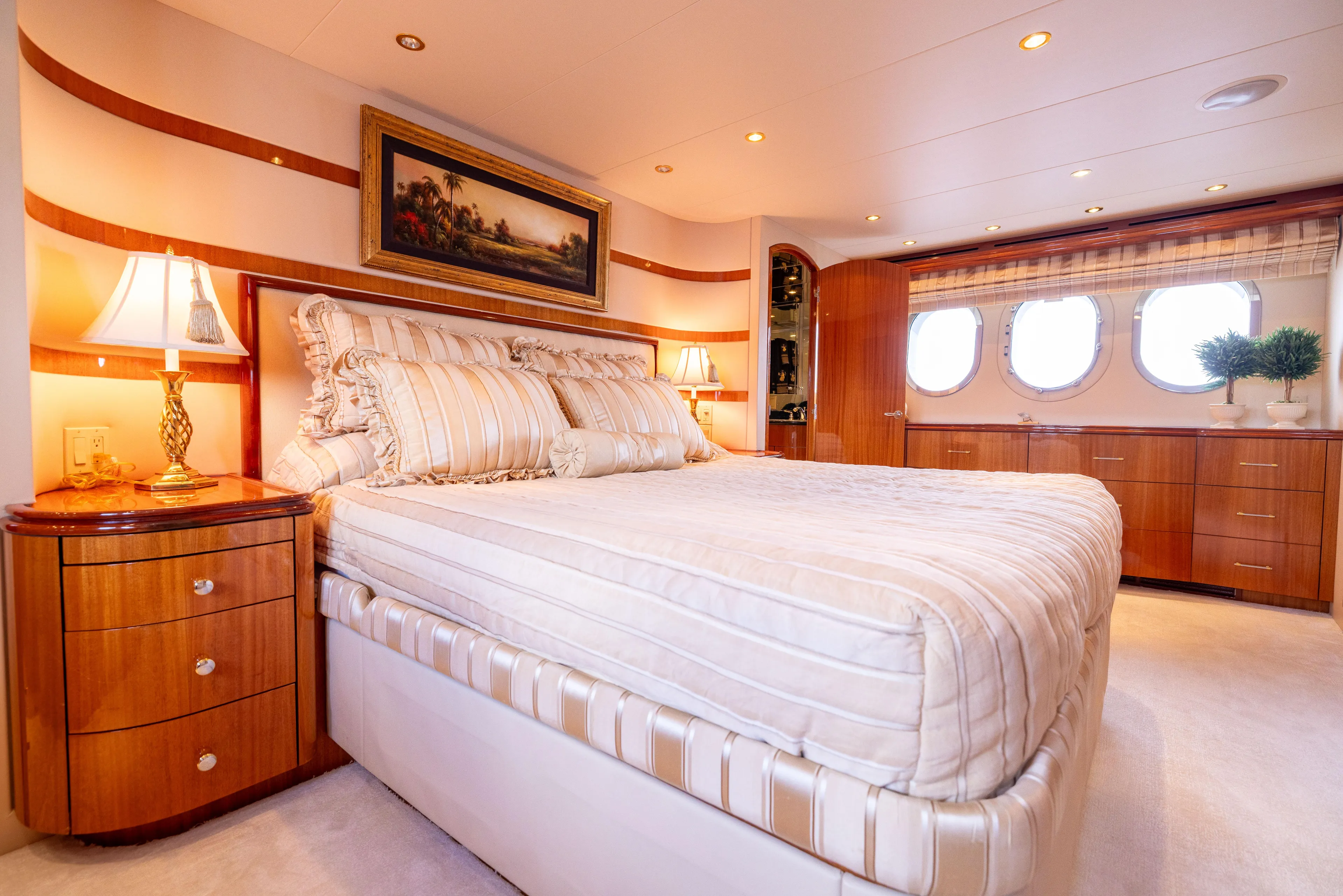 Outrageous Yacht Photos Pics Luxurious bedroom interior of 2005 Hatteras 80 Motor Yacht with elegant decor and natural light.