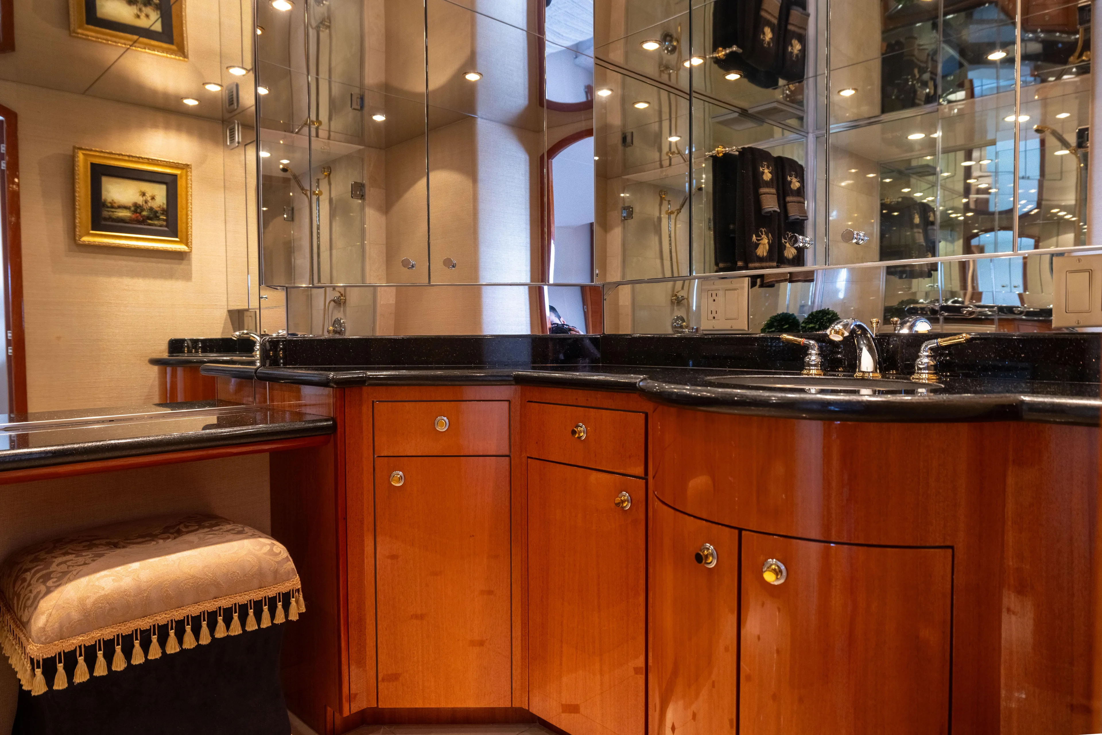 Outrageous Yacht Photos Pics Luxurious bathroom interior of 2005 Hatteras 80 Motor Yacht with elegant wood cabinetry.