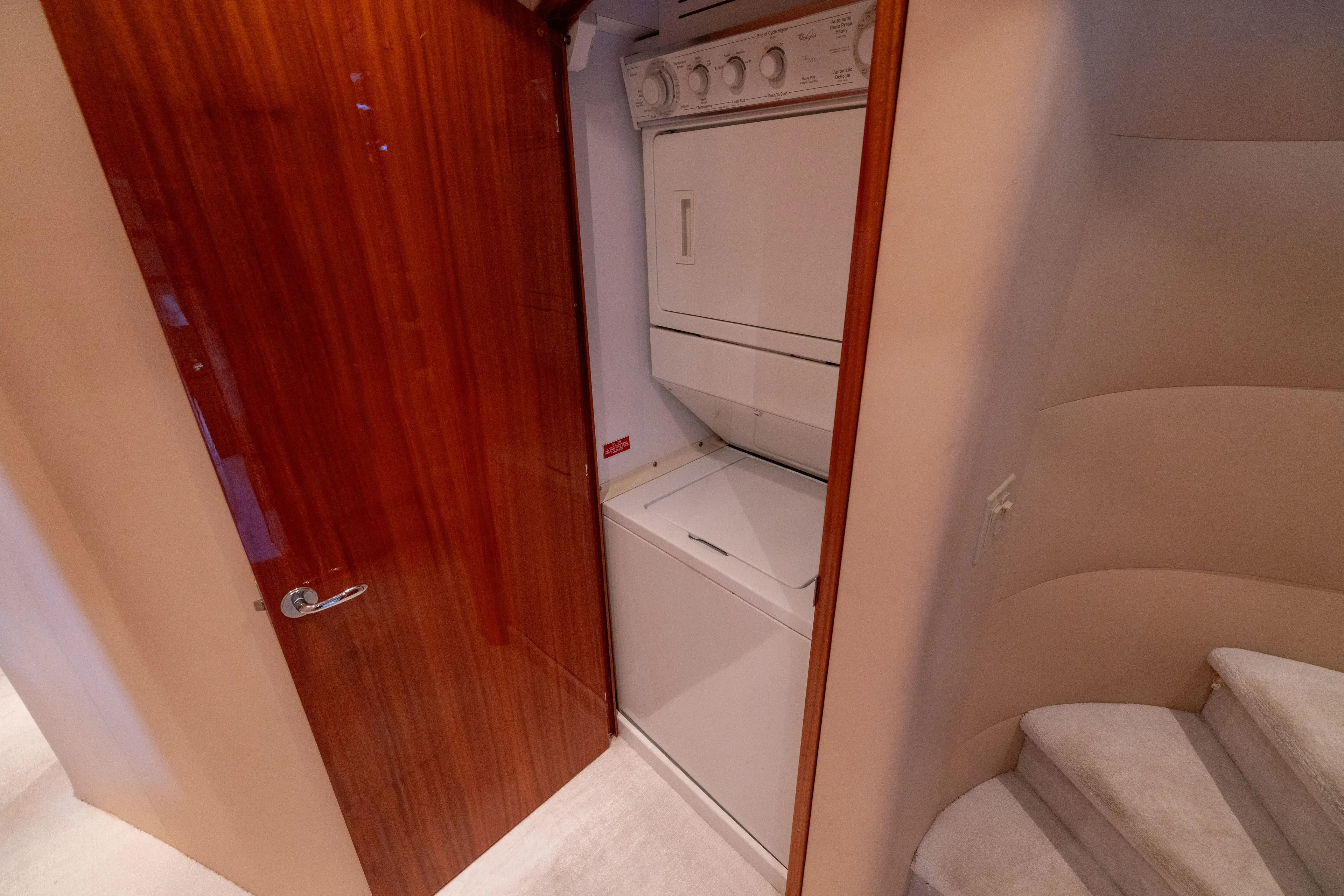 Outrageous Yacht Photos Pics Laundry area in 2005 Hatteras 80 Motor Yacht with stacked washer and dryer.