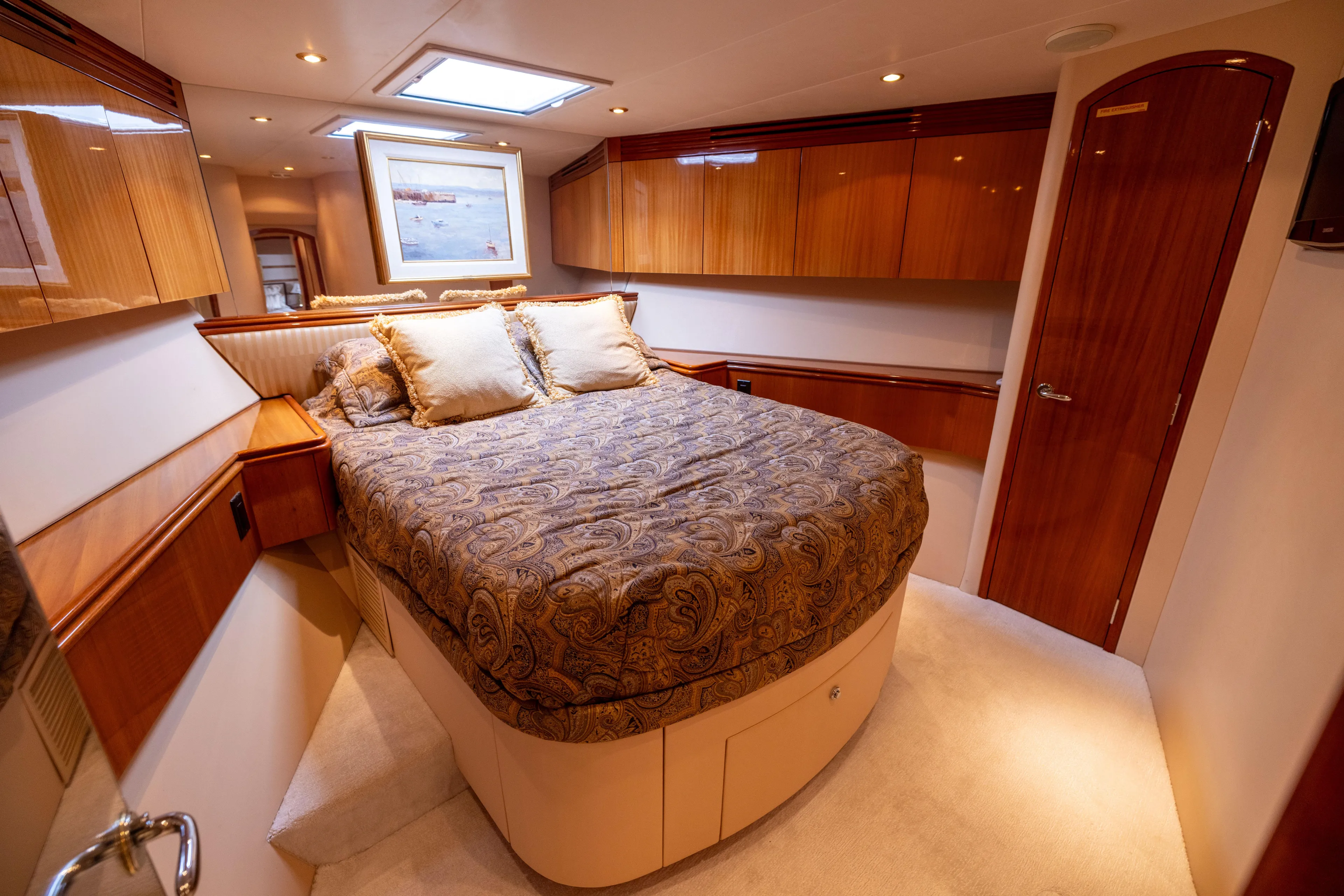 Outrageous Yacht Photos Pics Luxurious bedroom interior of 2005 Hatteras 80 Motor Yacht with elegant wood finishes.