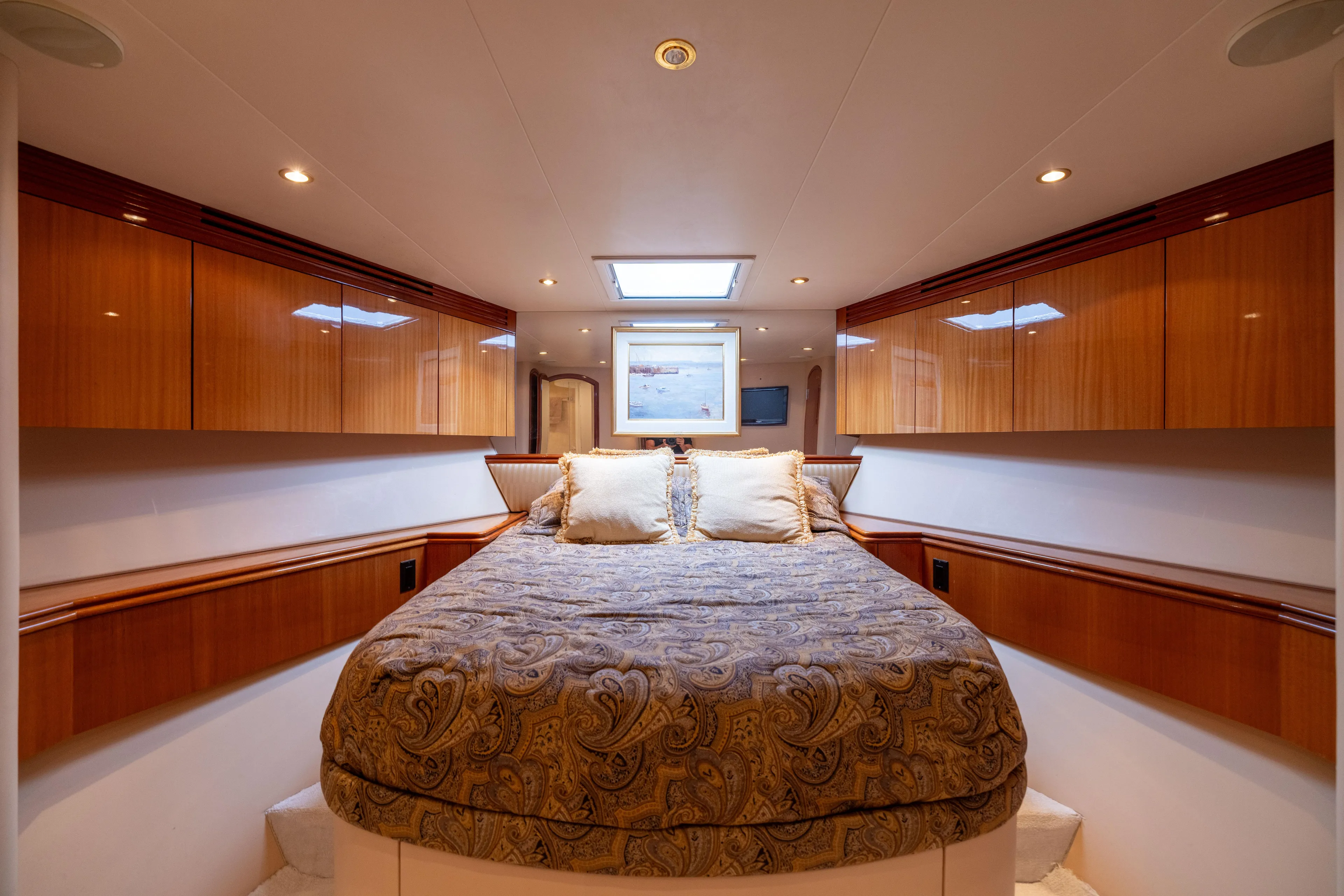 Outrageous Yacht Photos Pics Luxurious bedroom interior of 2005 Hatteras 80 Motor Yacht with elegant wood finishes.