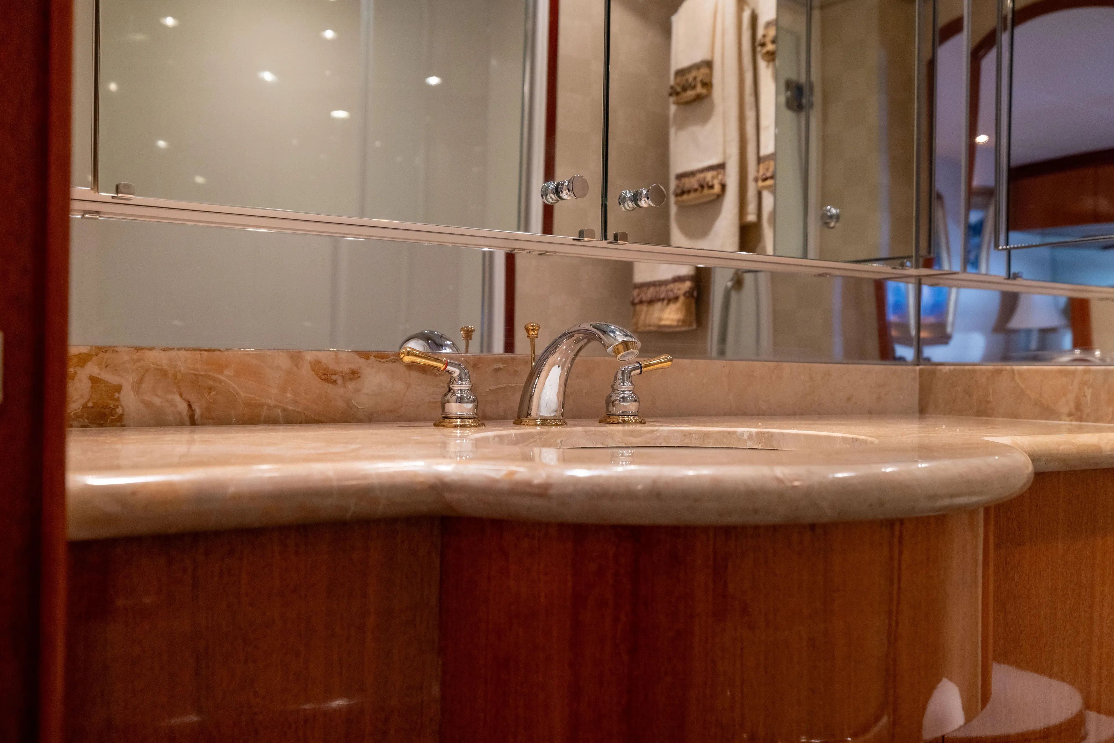 Outrageous Yacht Photos Pics Luxurious bathroom vanity on 2005 Hatteras 80 Motor Yacht with marble countertop and elegant fixtures.