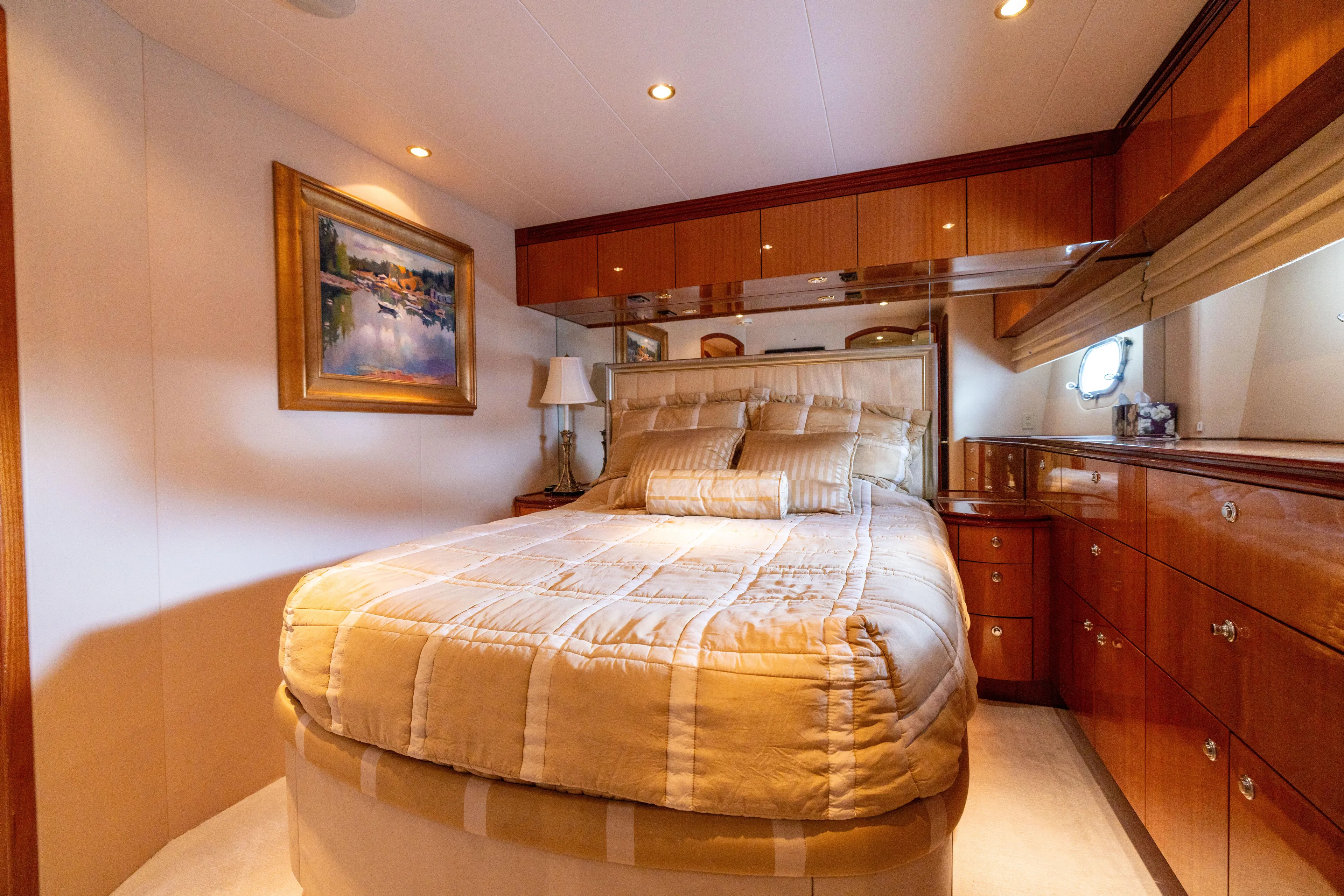 Outrageous Yacht Photos Pics Luxurious bedroom interior of 2005 Hatteras 80 Motor Yacht with elegant wood finishes.