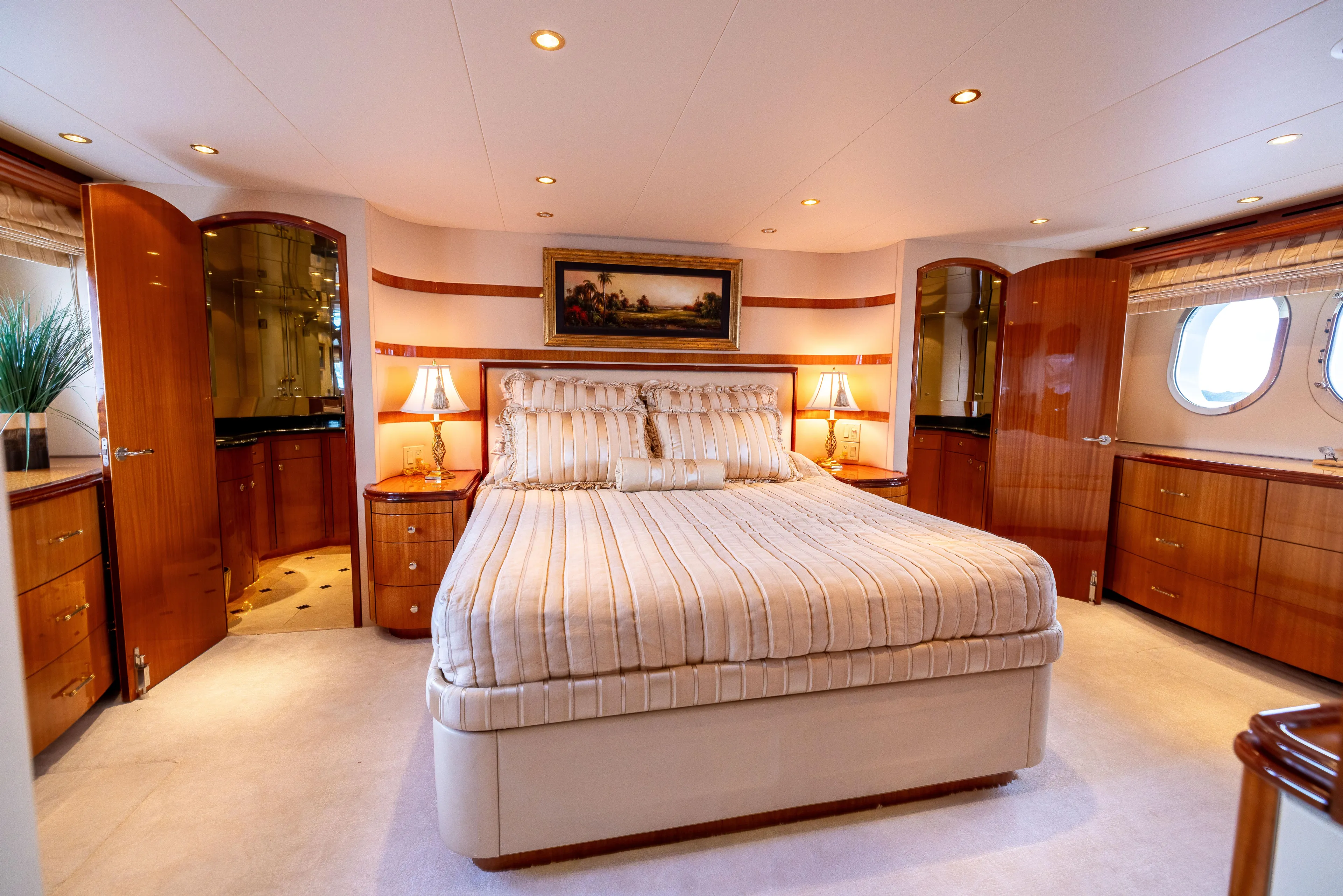Outrageous Yacht Photos Pics Luxurious bedroom interior of 2005 Hatteras 80 Motor Yacht with elegant wood finishes.