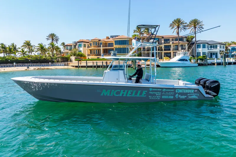  Yacht Photos Pics 2023 Contender 39ST boat on water near luxury waterfront homes.