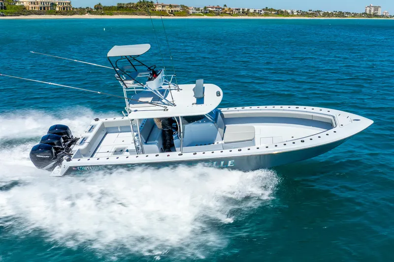  Yacht Photos Pics 2023 Contender 39ST boat cruising on blue ocean waters.