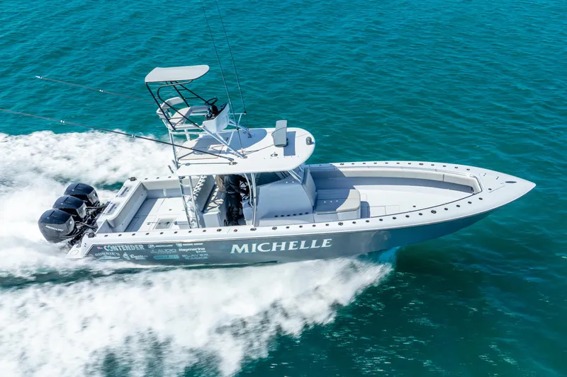  Yacht Photos Pics 2023 Contender 39ST boat cruising on blue ocean water.