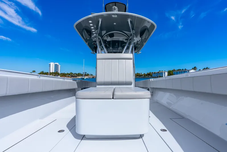  Yacht Photos Pics 2023 Contender 39ST boat with sleek seating and modern design under a clear blue sky.
