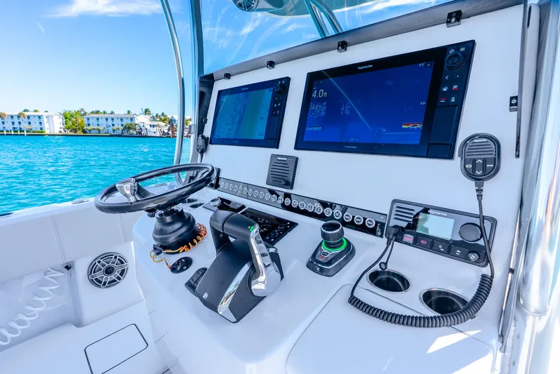  Yacht Photos Pics 2023 Contender 39ST boat dashboard with advanced navigation systems and controls.