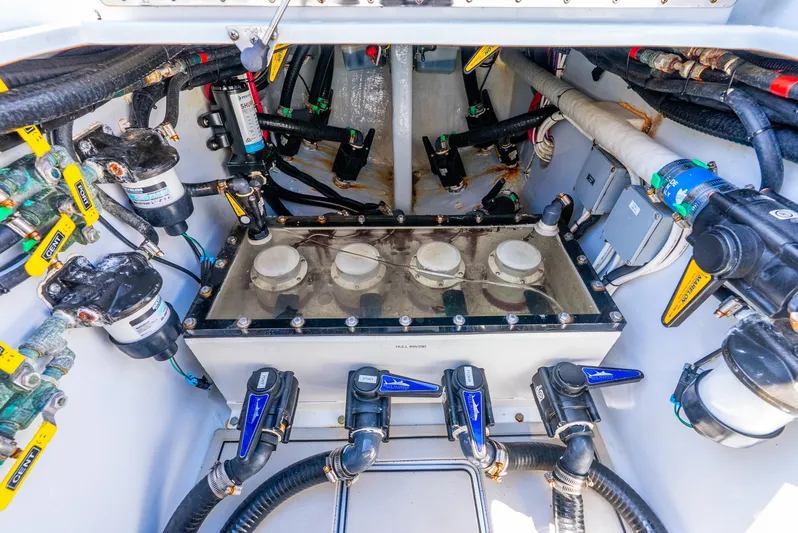  Yacht Photos Pics Engine compartment of 2023 Contender 39ST boat, showcasing intricate mechanical components.