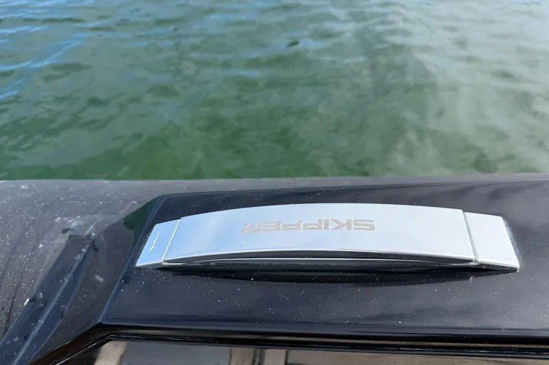  Yacht Photos Pics Skipper-BSK 42NC boat detail, 2023 model, on calm water.