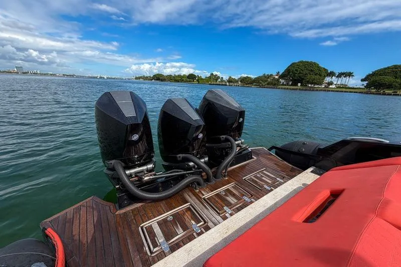  Yacht Photos Pics 2023 Skipper-BSK 42NC boat with triple outboard engines on a sunny day.