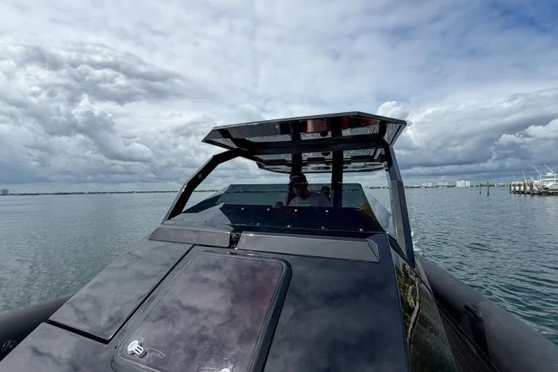  Yacht Photos Pics 2023 Skipper-BSK 42NC boat on calm water under cloudy sky.