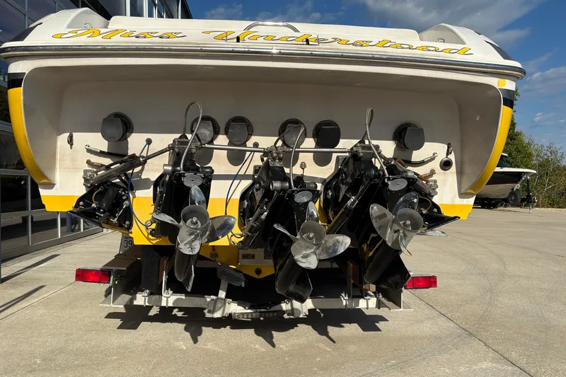  Yacht Photos Pics Rear view of a 2002 Donzi 45 ZX boat with triple propellers.