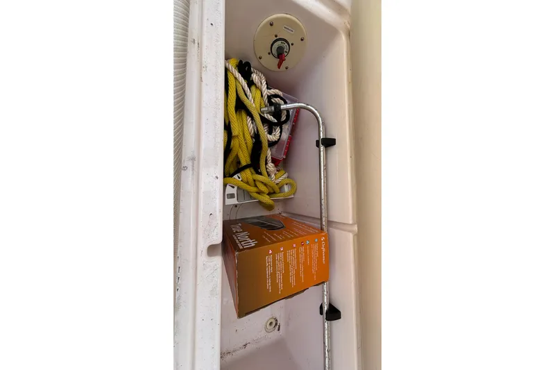  Yacht Photos Pics Storage compartment in a 2002 Donzi 45 ZX boat with ropes and equipment.