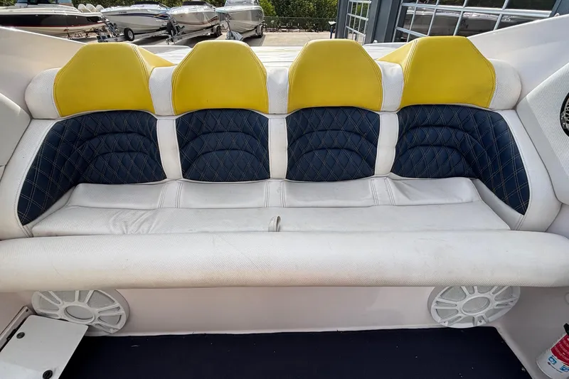  Yacht Photos Pics 2002 Donzi 45 ZX boat interior with yellow and blue cushioned seating.