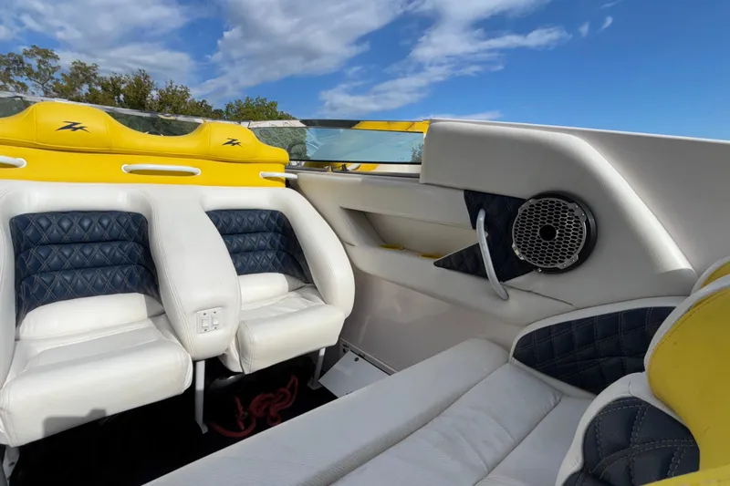  Yacht Photos Pics Interior of a 2002 Donzi 45 ZX boat with white and yellow seating.