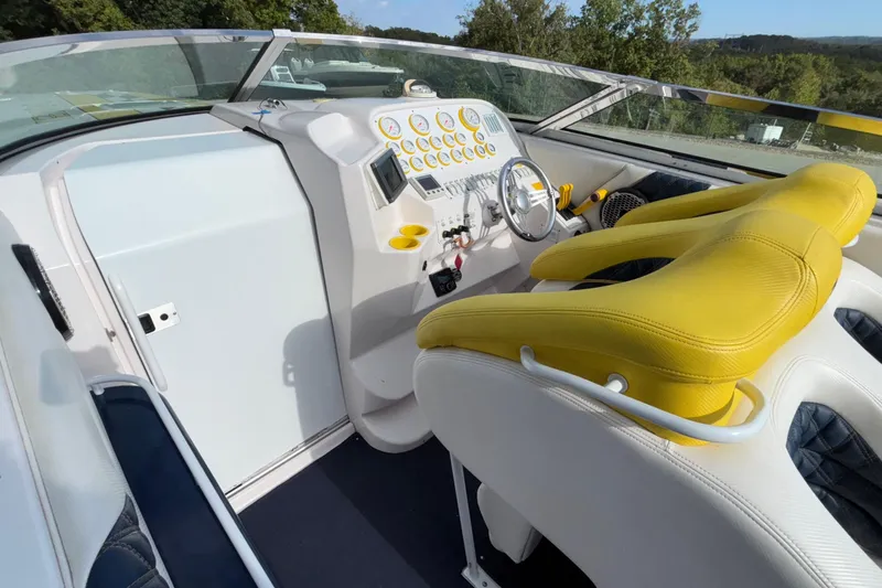  Yacht Photos Pics Interior of a 2002 Donzi 45 ZX boat with yellow seats and control panel.