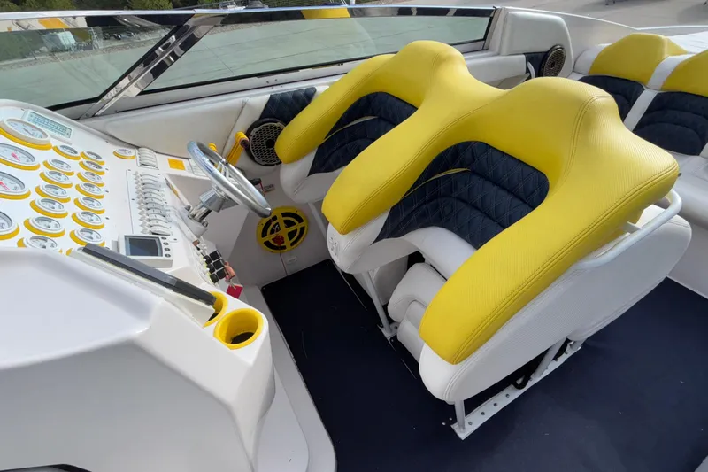  Yacht Photos Pics 2002 Donzi 45 ZX boat cockpit with yellow and black seats, detailed dashboard.