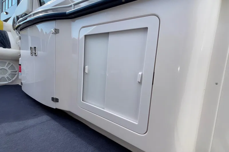  Yacht Photos Pics 2002 Donzi 45 ZX boat interior detail with storage compartment and sleek design.