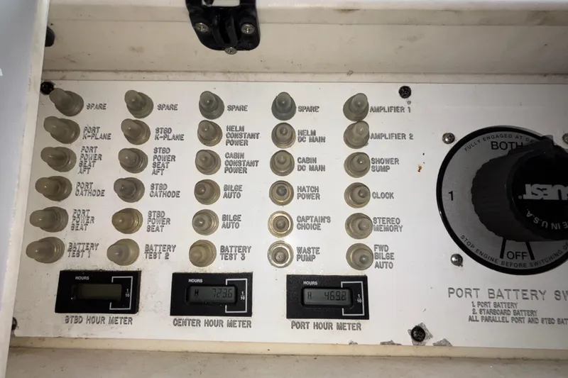 Yacht Photos Pics Control panel of a 2002 Donzi 45 ZX boat with switches and hour meters.