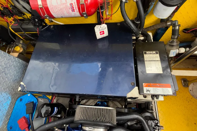  Yacht Photos Pics Engine compartment of a 2002 Donzi 45 ZX boat with Kohler generator and fire extinguisher.