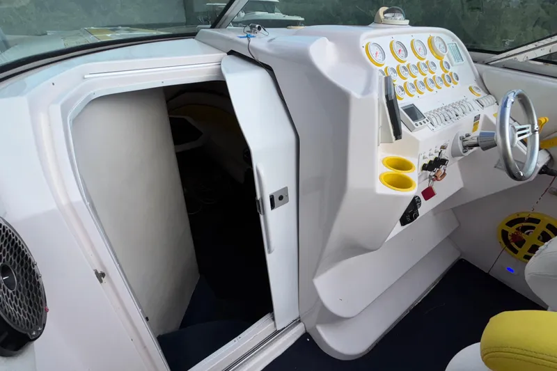  Yacht Photos Pics 2002 Donzi 45 ZX boat cockpit with steering wheel and control panel.