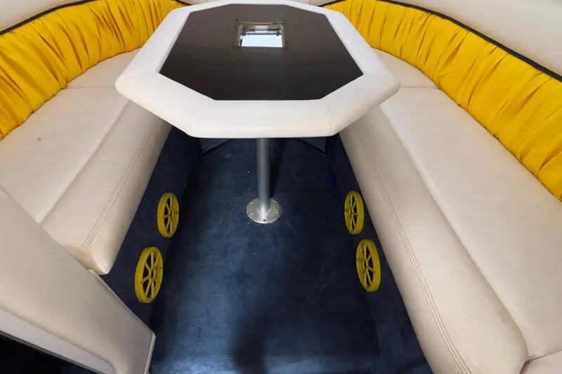  Yacht Photos Pics 2002 Donzi 45 ZX interior with yellow seating and octagonal table.