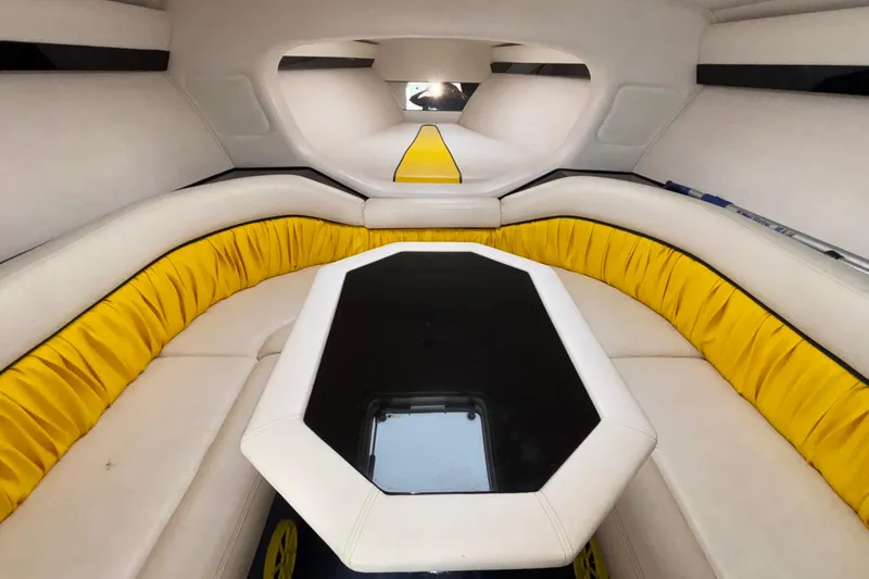  Yacht Photos Pics Interior of 2002 Donzi 45 ZX boat with yellow and white seating and black table.